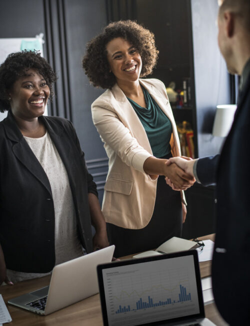 Business partners shaking hands in agreement Business partners shaking hands in agreement