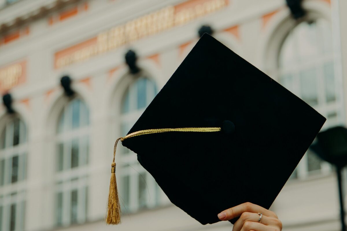Canada Study Permit Refusal student in cap reading rejection letter