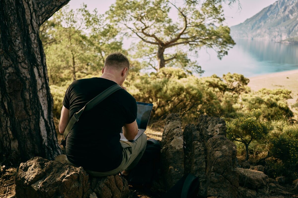 EU Digital Nomad Visas 2026 African remote worker with laptop in European cafe