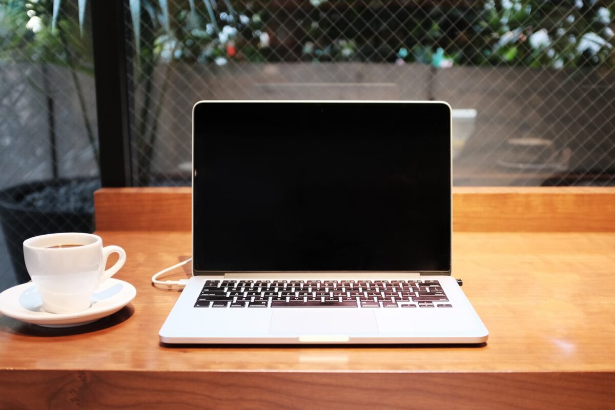 Remote worker laptop in a European cafe — EU Digital Nomad Visas 2026 comparison for Africans