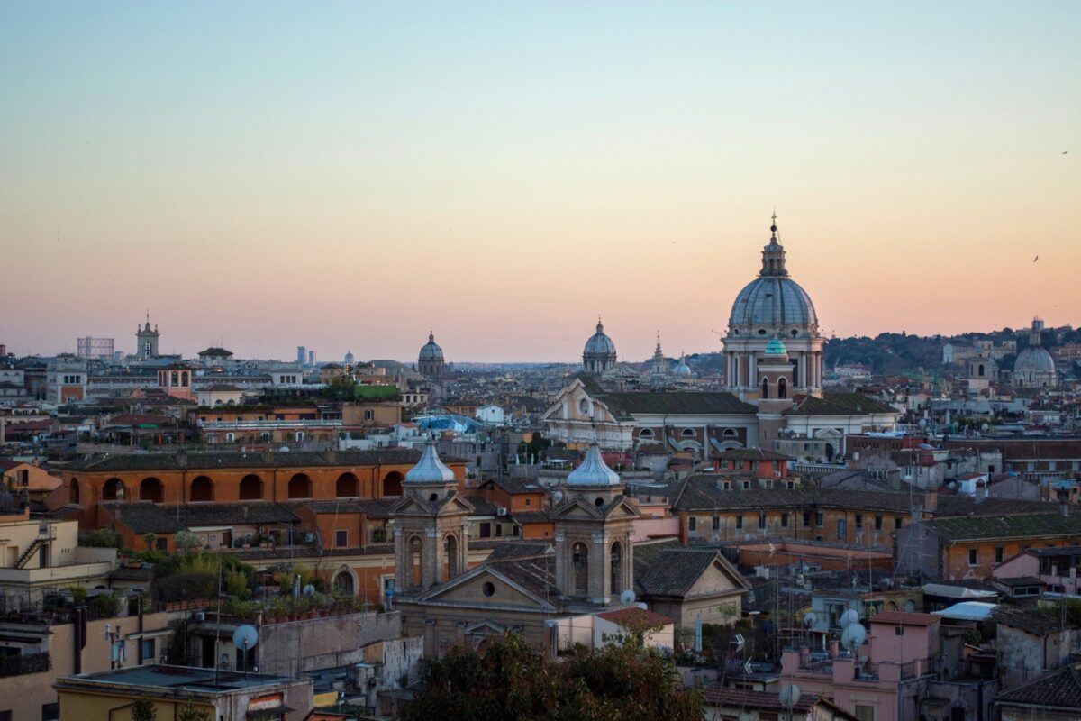 Italy Digital Nomad Visa 2026 — remote worker with laptop in a Roman café for African applicants