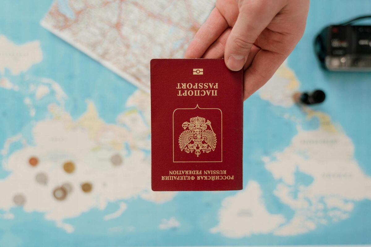 close up photo of a passport held by a person