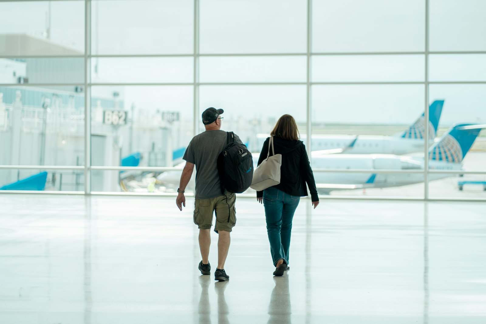 UK Spouse Visa 2026 couple walking through airport with luggage