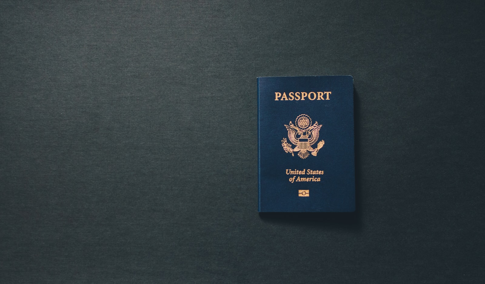 USCIS adjustment of status 2026 — passport and US flag