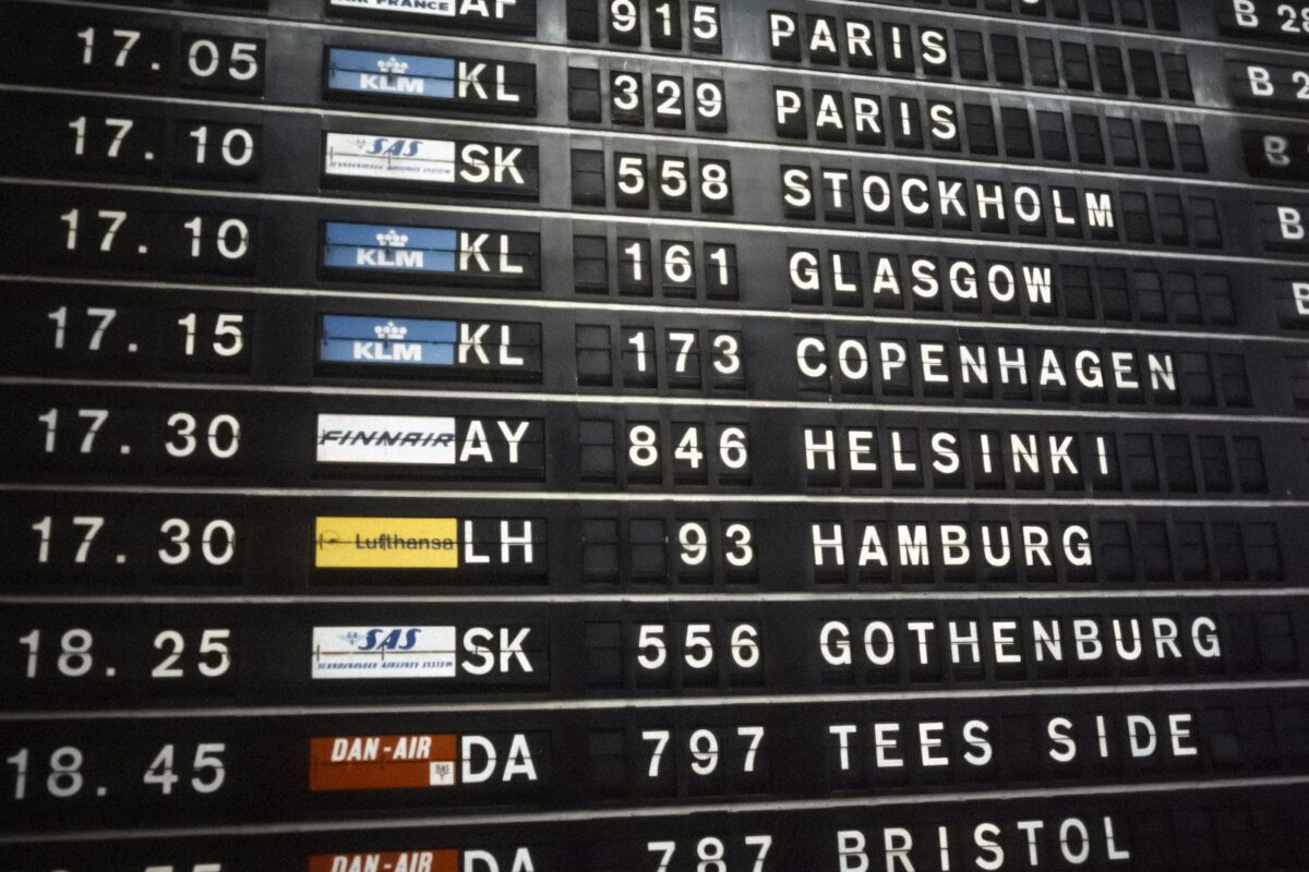 Cost to move abroad 2026 shown on an airport departures board