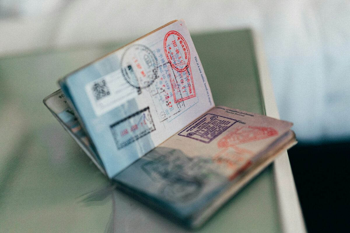 skilled worker visa refusal reasons, application documents on a desk
