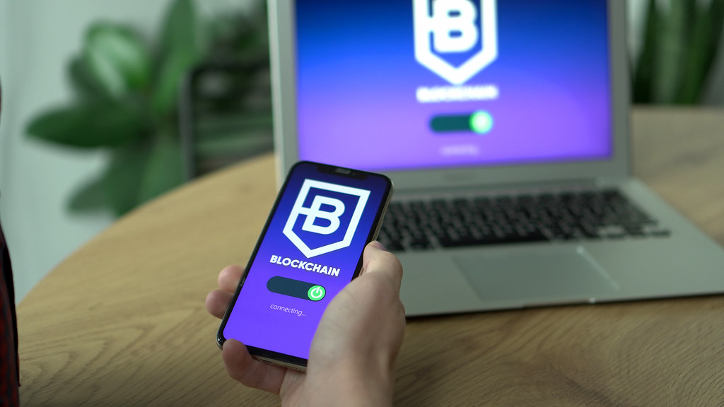 CoinCola first trade bonus illustrated by a mobile crypto transfer on a smartphone