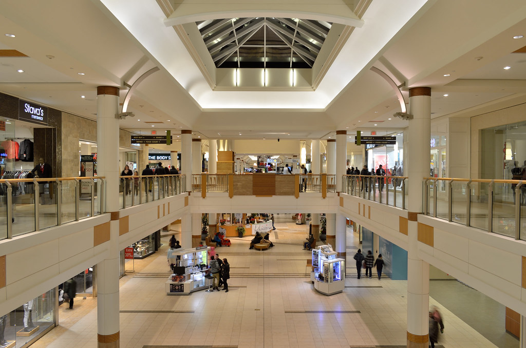 Shoppers in a mall reflecting retail earnings consumer spending patterns