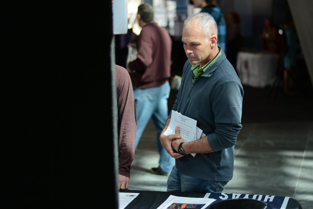 International students at a university fair affected by the duration of status rule