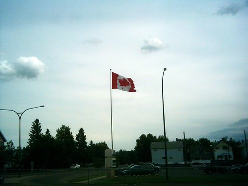IRCC processing time update illustrated by a Canadian passport