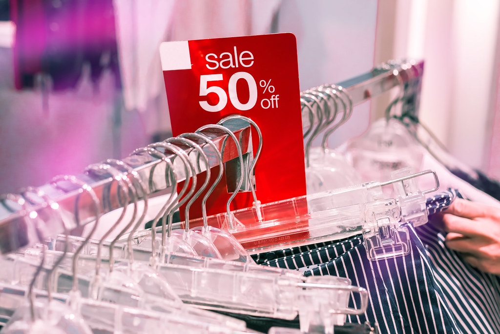 Retail clothing racks as Lululemon cuts full-year forecast for the second time in 2026