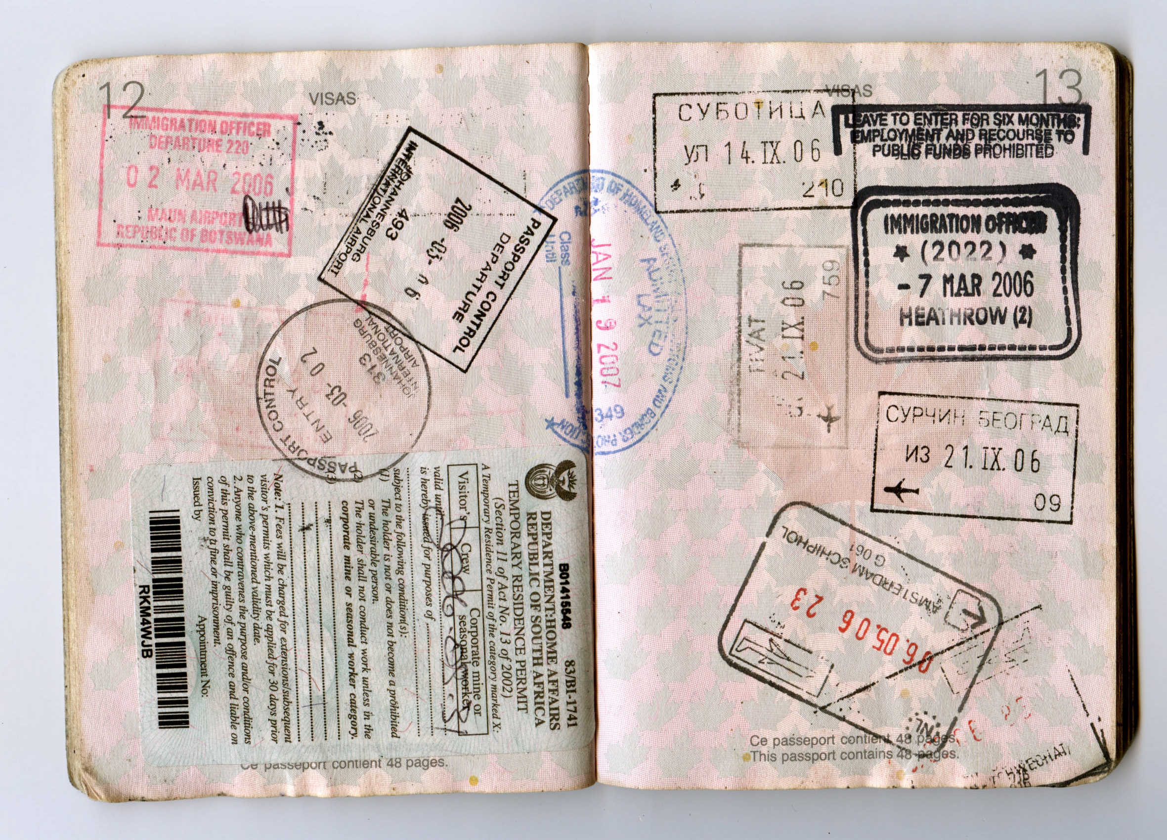 Passport pages with stamps, relevant to the new public charge rule green card standard