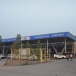 Airport terminal departure board representing the US flight delays surge