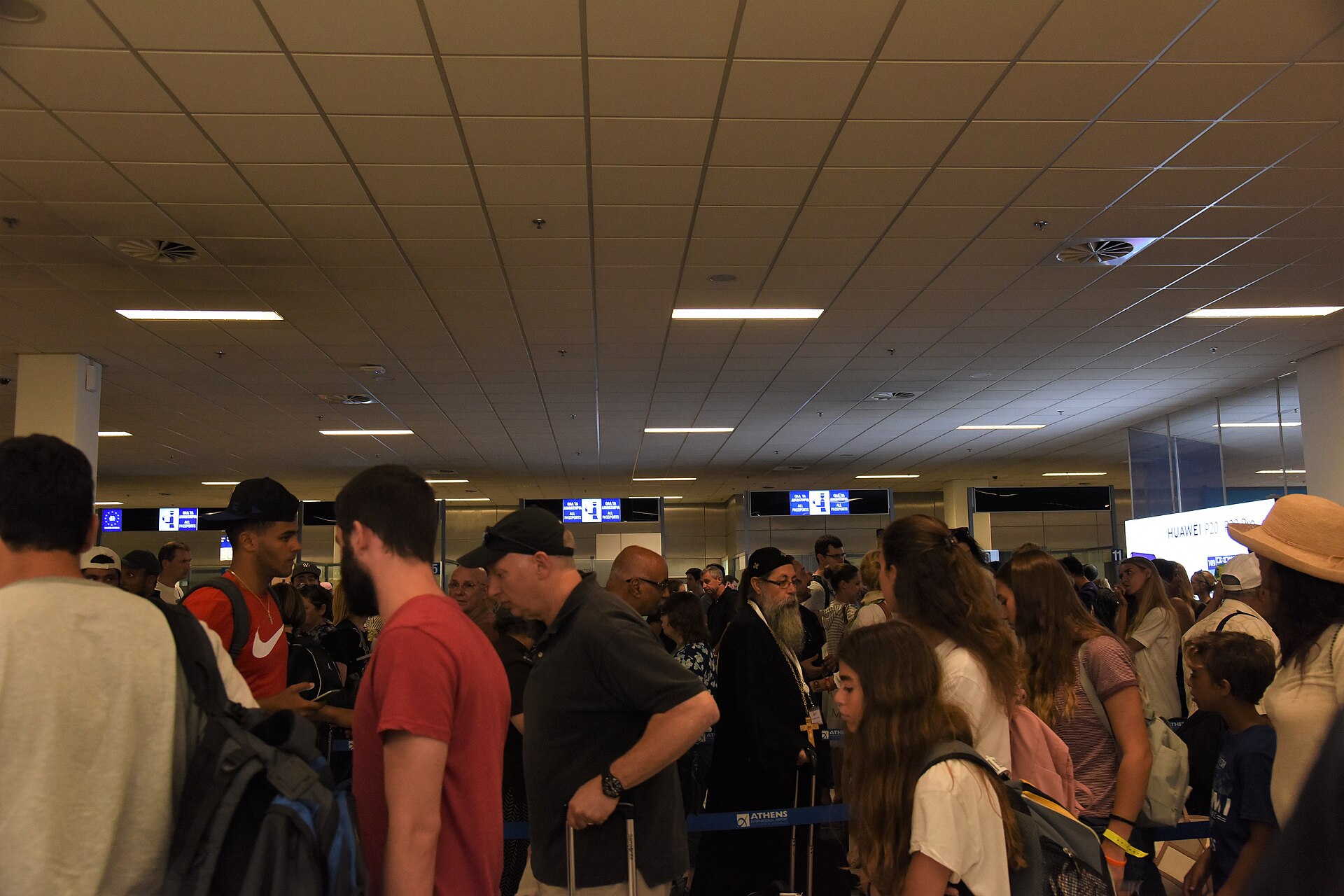 Airport passport control booth amid the ETIAS launch delay 2027