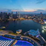 Singapore skyline at dusk, where the Singapore work pass changes take effect October 29