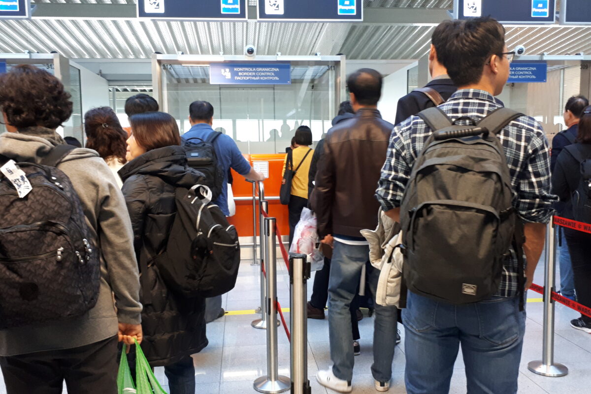 Spain Italy border checks: passport control queue at an airport