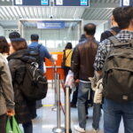 Spain Italy border checks: passport control queue at an airport