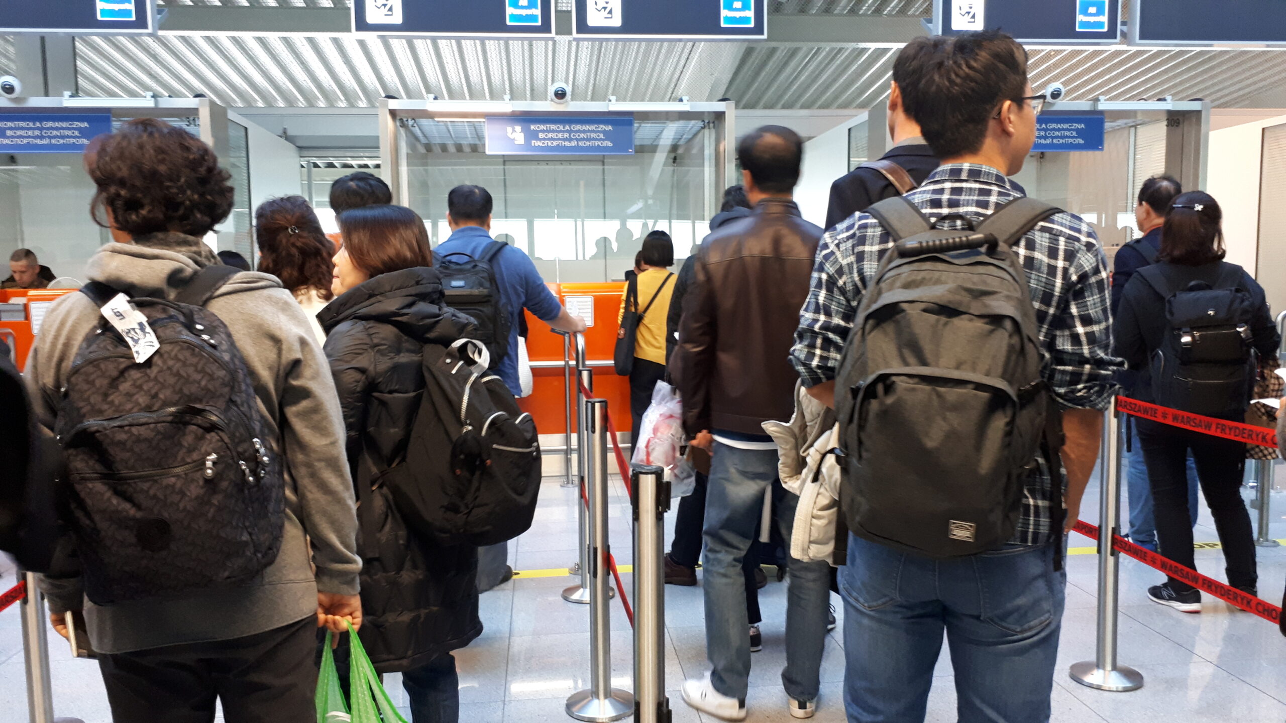 Spain Italy border checks: passport control queue at an airport